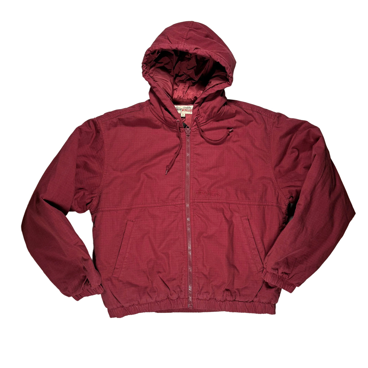 A burgundy zip-up hooded jacket laid flat on a white surface.