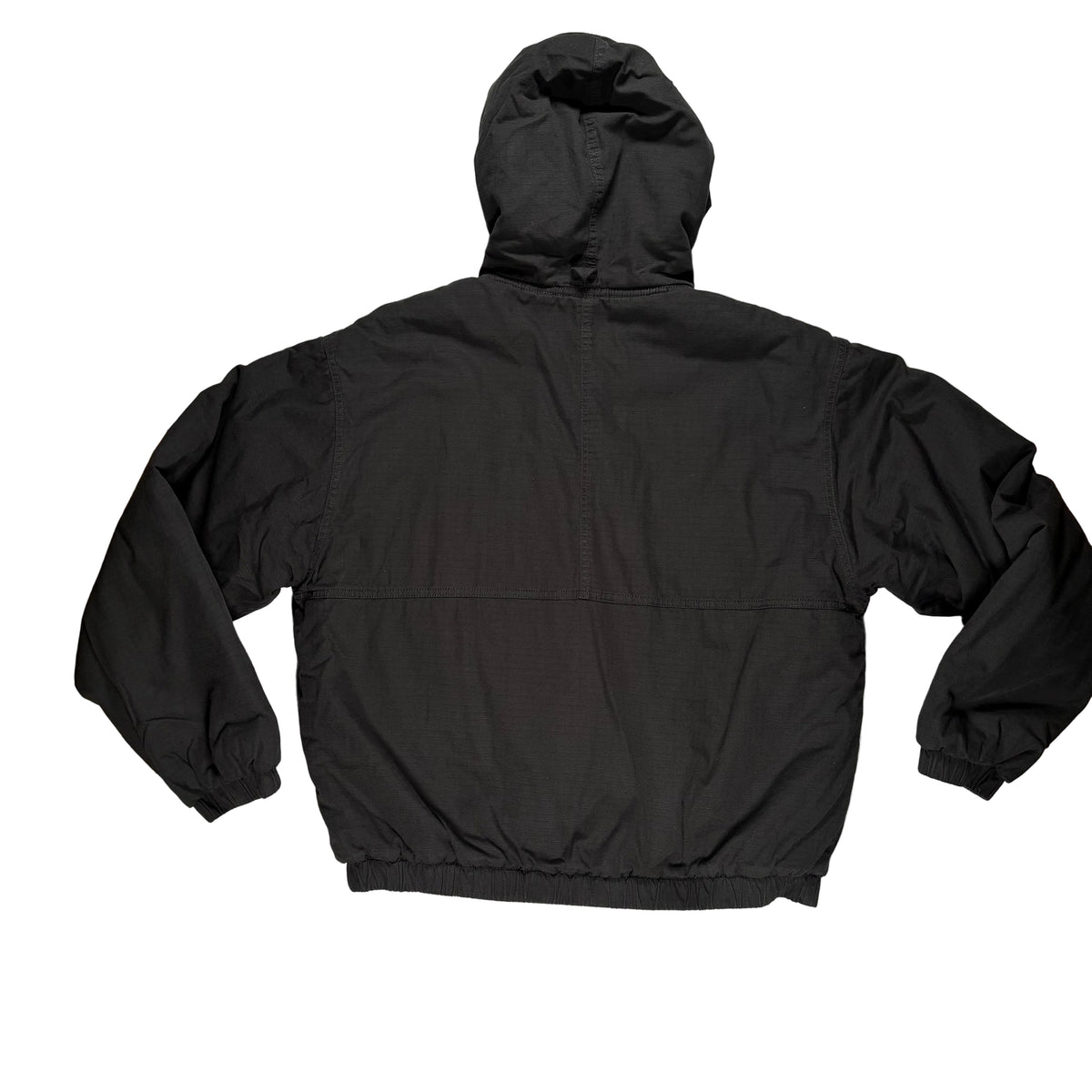 Back view of a  black hooded jacket laid flat on a white surface.