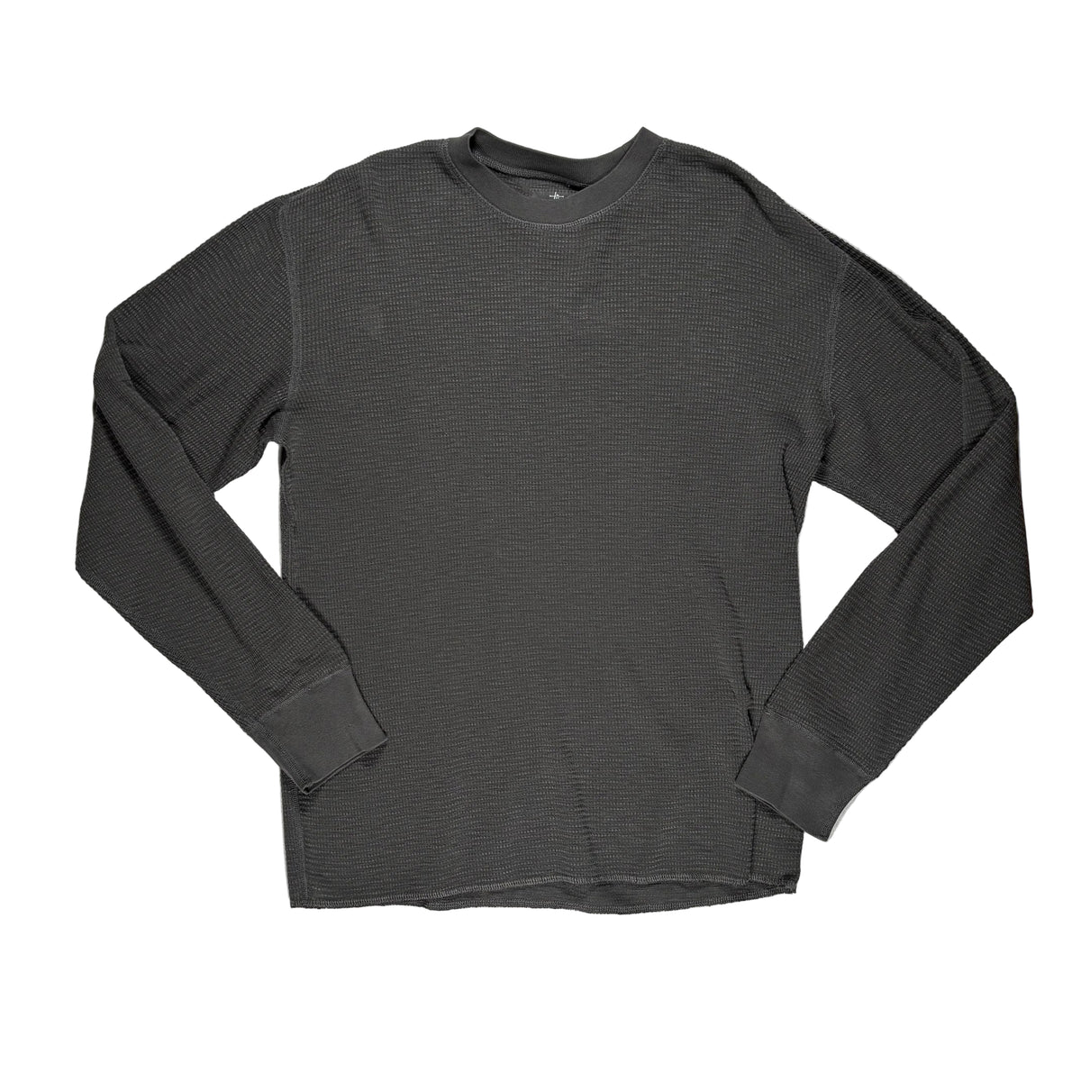 A faded black ribbed long-sleeve crewneck shirt laid flat on a white surface.