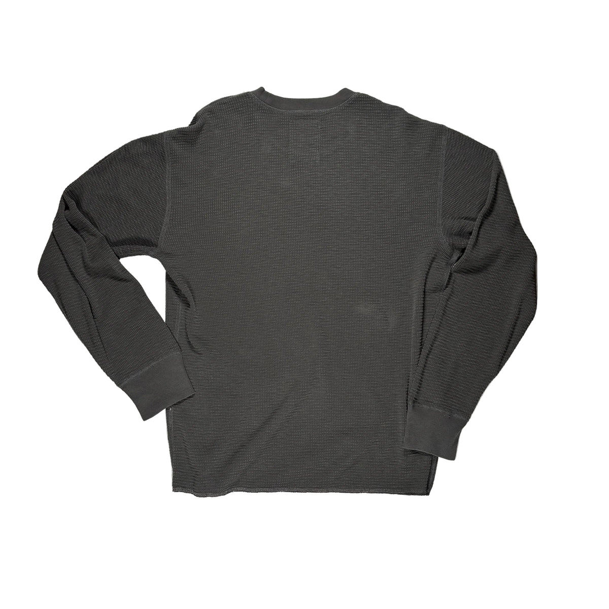 A faded black ribbed long-sleeve shirt laid flat on a white surface.