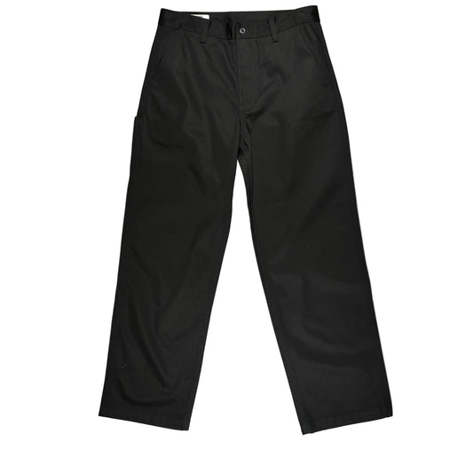 Black trousers laid flat on a white surface.