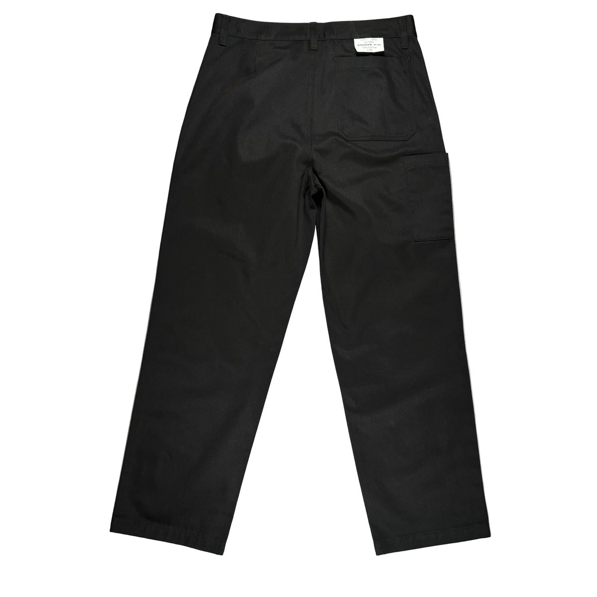 Black trousers laid flat on a white surface. 