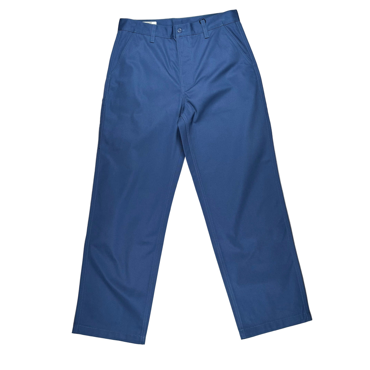 A pair of blue chino pants laid flat on a white surface.