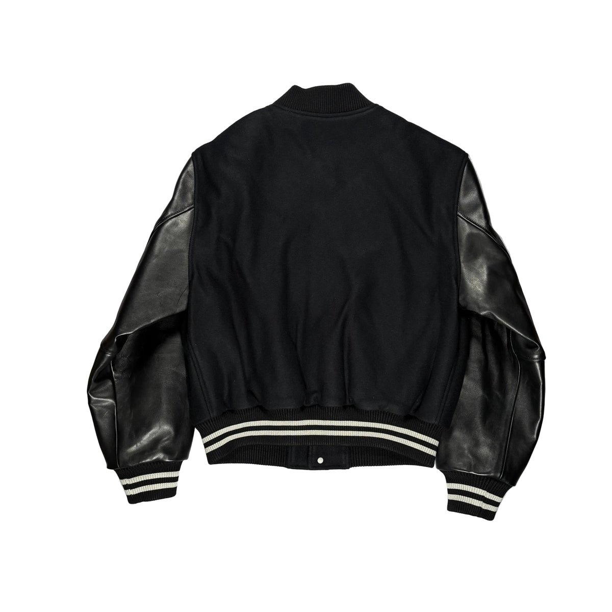 Black varsity-style jacket with black leather sleeves, shown from the back on a white surface.