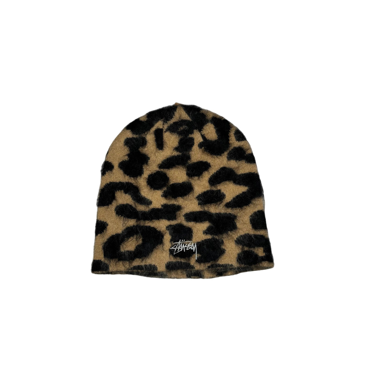 A fuzzy beanie hat with a leopard print pattern in tan and black, featuring a small Stussy logo embroidered near the bottom, displayed on a white background.
