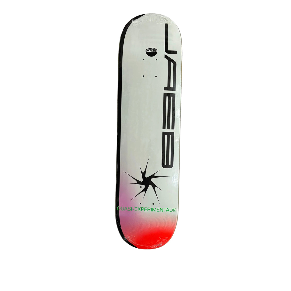 A white skateboard deck with black graphics and a starburst motif, and a red-to-pink gradient near the tail, photographed against a white surface.