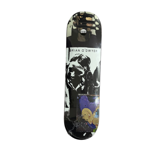A skateboard deck featuring a black and white graphic portrait, with a purple and yellow illustration at the bottom, displayed vertically on a white surface.