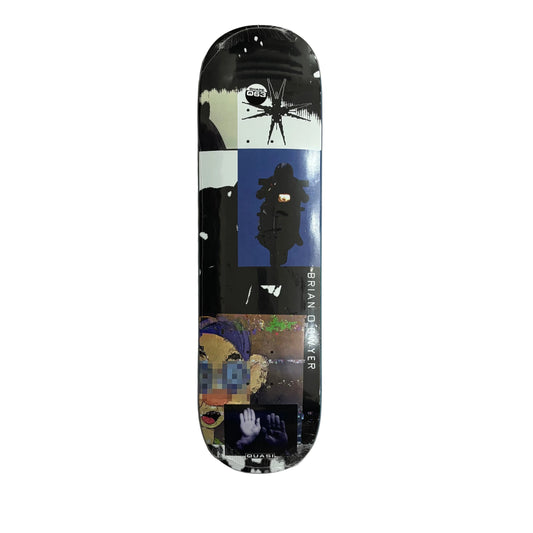 A skateboard deck featuring a collage-style graphic design with black, white, blue, and multicolor abstract art, photographed flat against a white background.