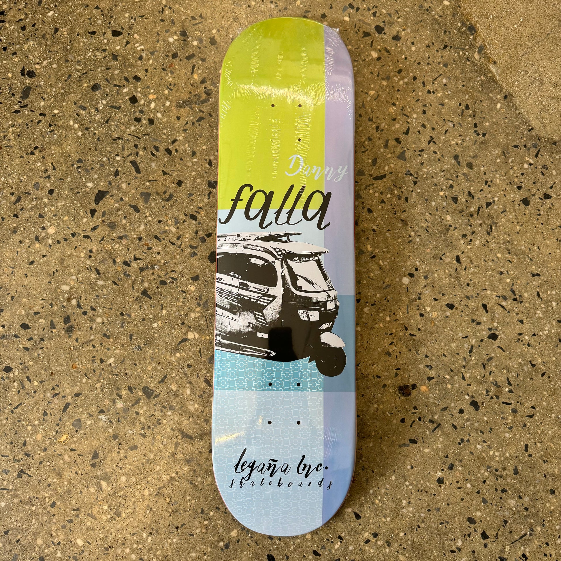 multicolored Skateboard deck with combi vehicle in the center