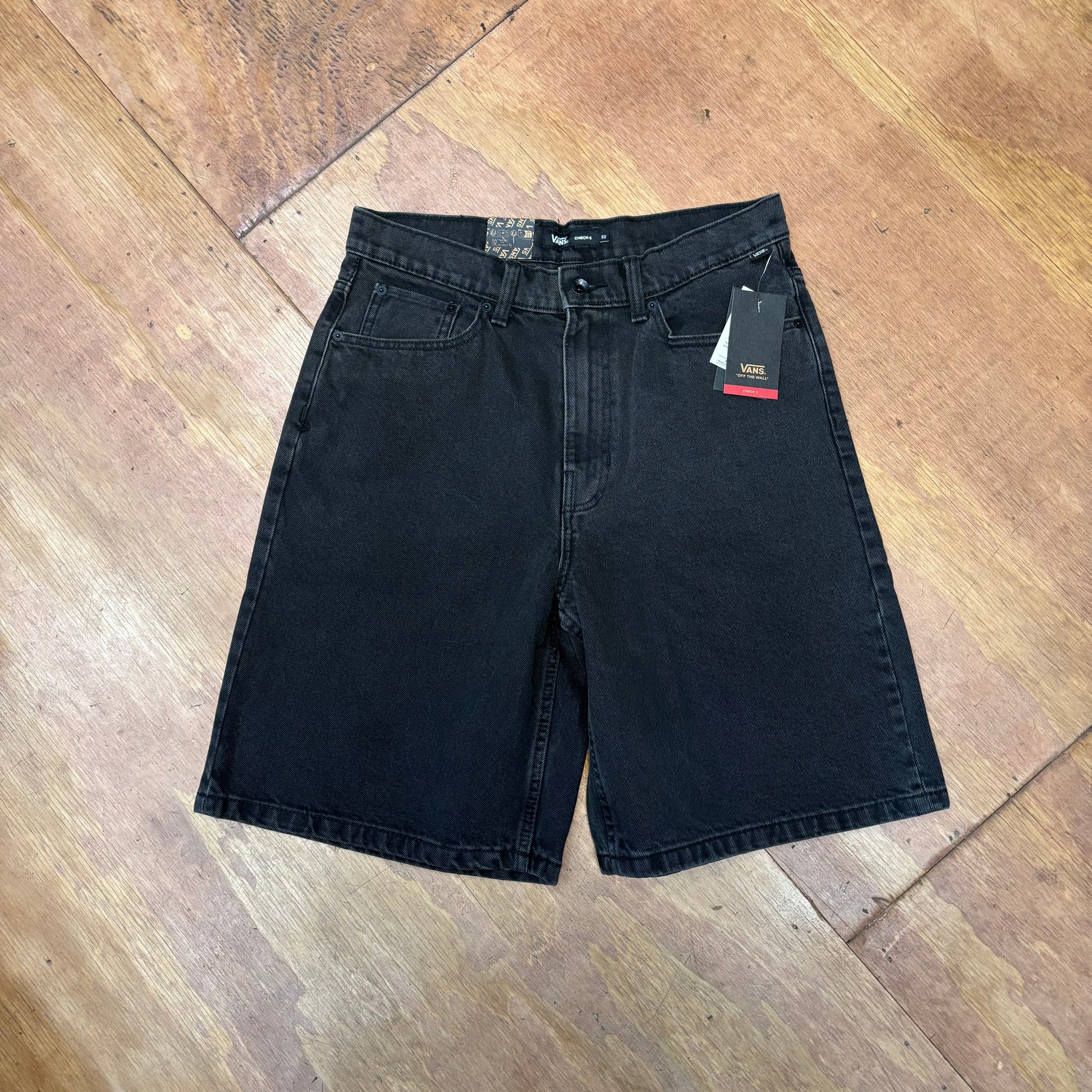 Front view of washed black baggy denim shorts