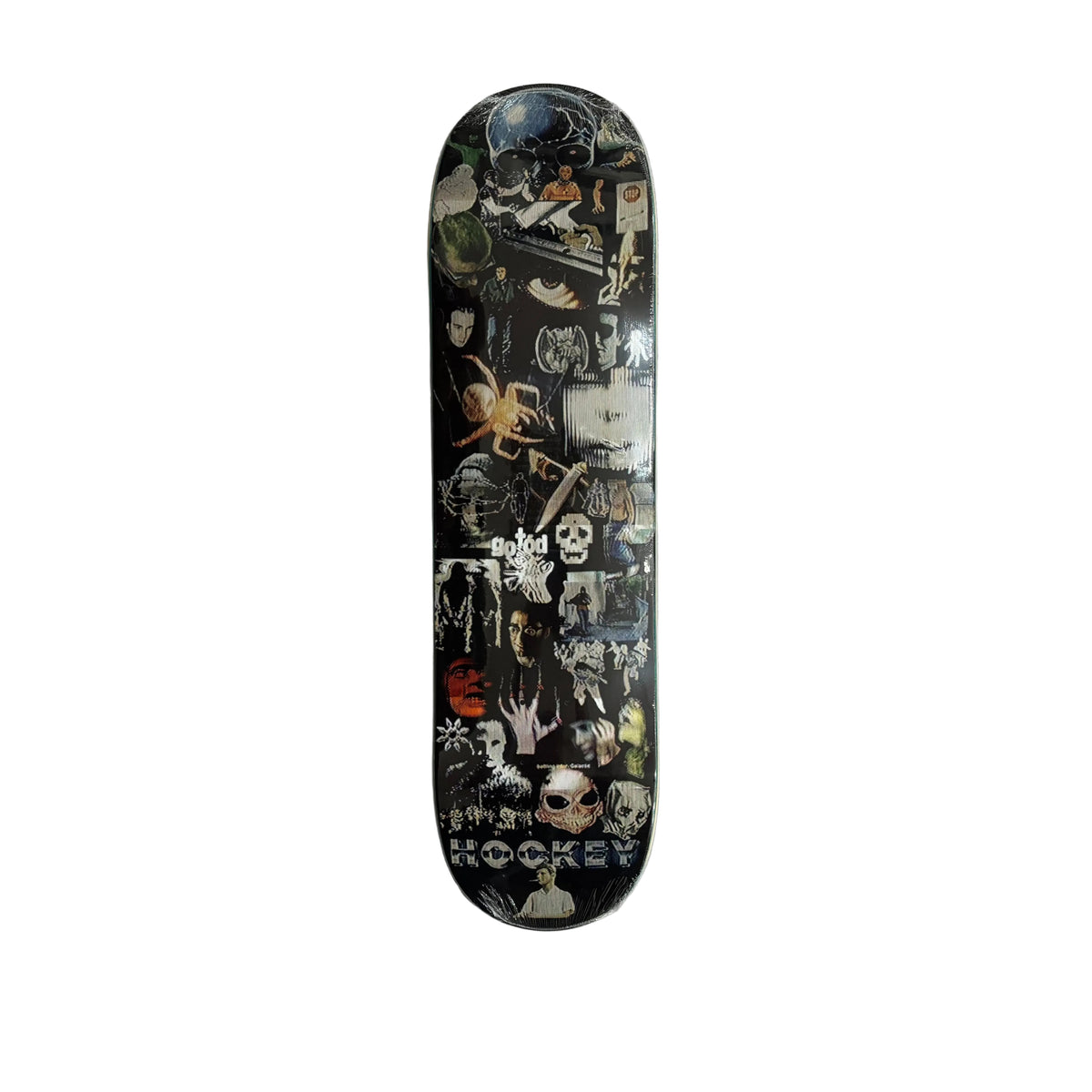 A skateboard deck with a black background and a dense collage of horror-themed graphics, skulls, spiders, and occult imagery, displayed vertically on a white sheet.