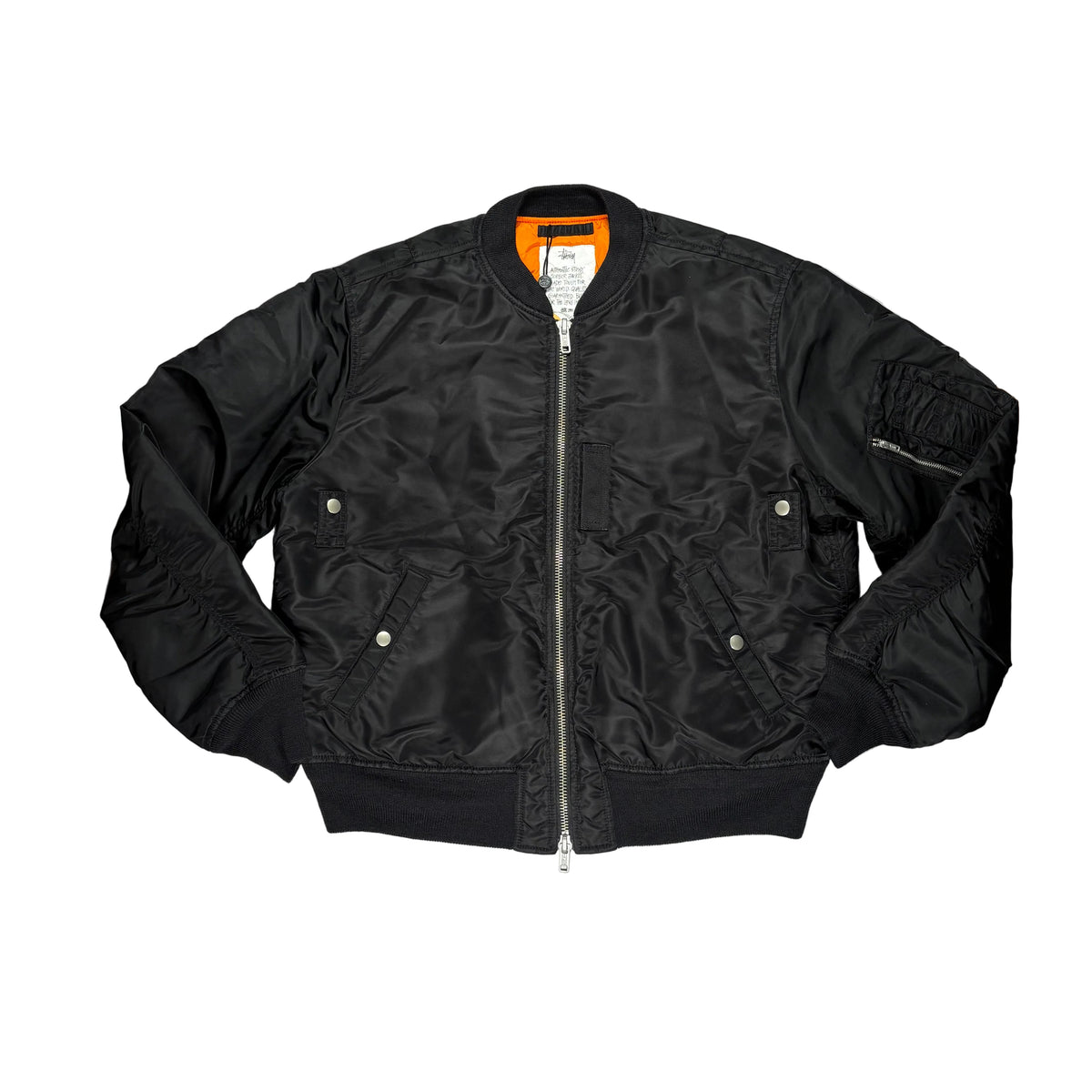 A black nylon MA-1 style bomber jacket  with silver zipper laid flat on a white surface.