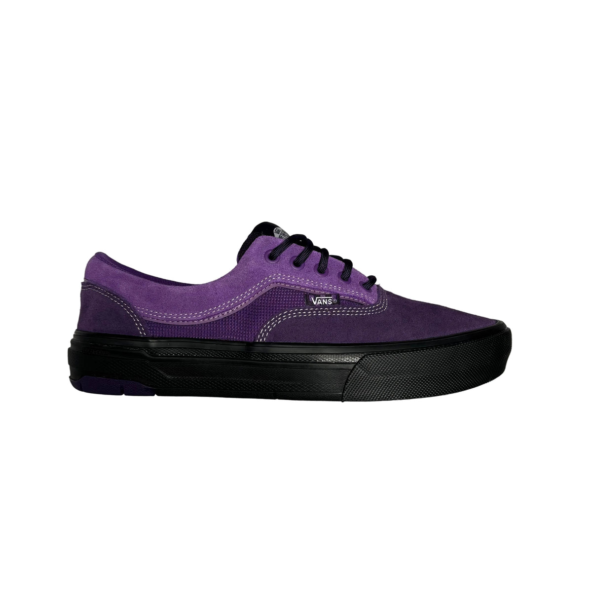 A purple suede Vans platform sneaker with black laces and a thick black platform sole, shown from a side profile against a white background.