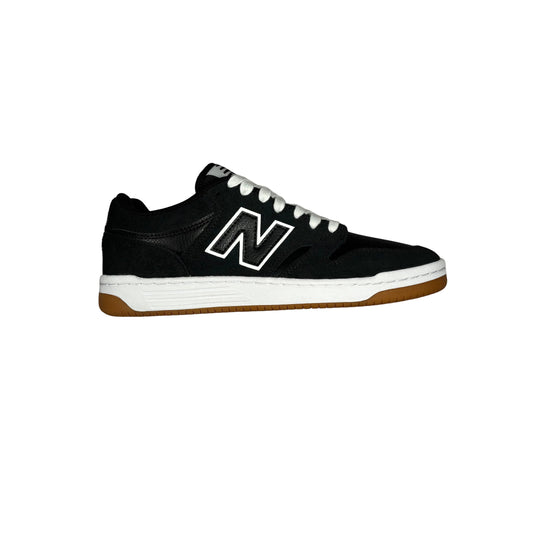 A single blackNew Balance sneaker, featuring a prominent white 'N' logo on the side, white laces, a white midsole, and a brown gum outsole, shown from a side profile against a white background.