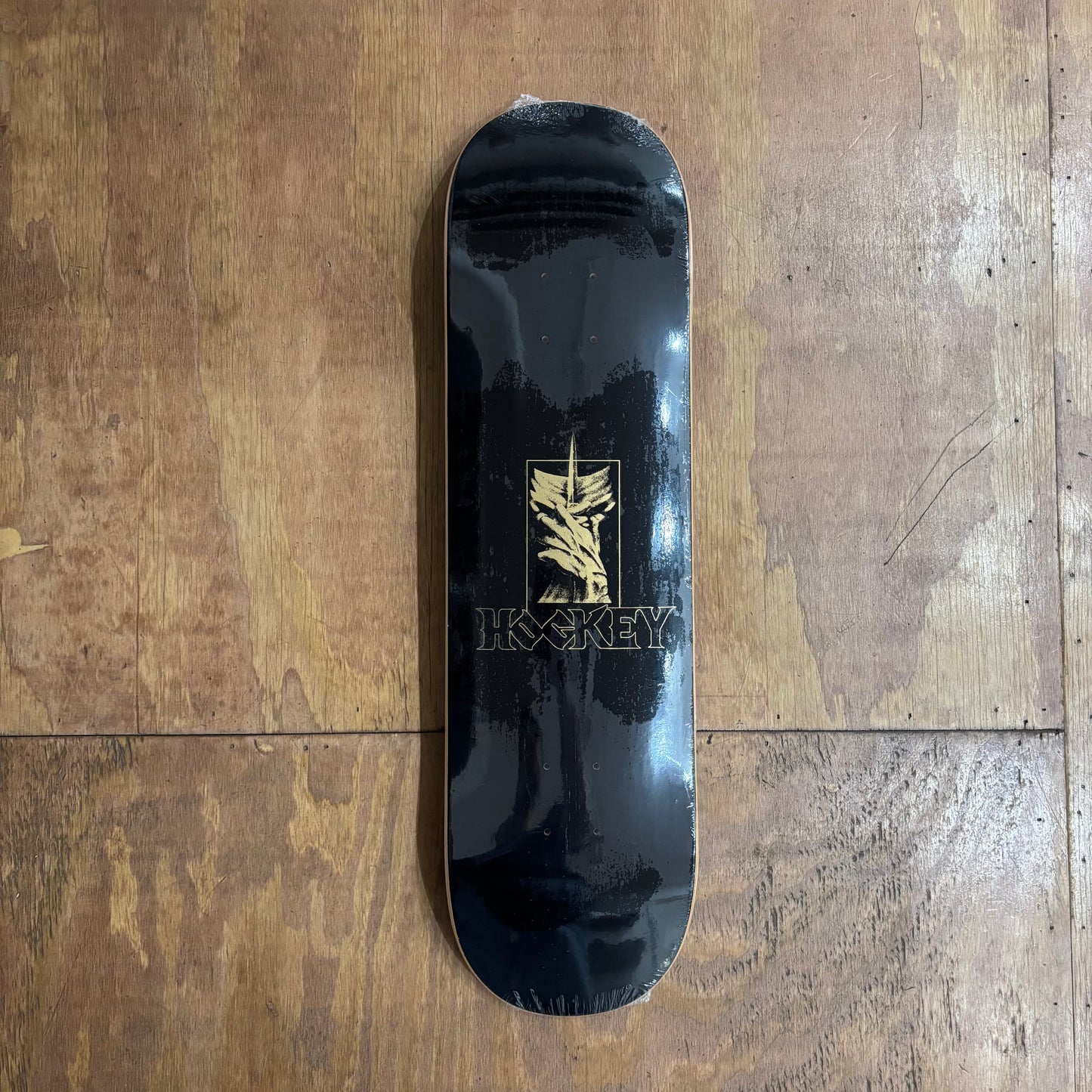 abstract face in middle of deck with HOCKEY written below
