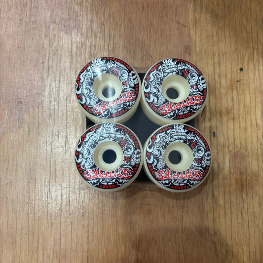 heavy metal looking graphic on white spitfire wheel