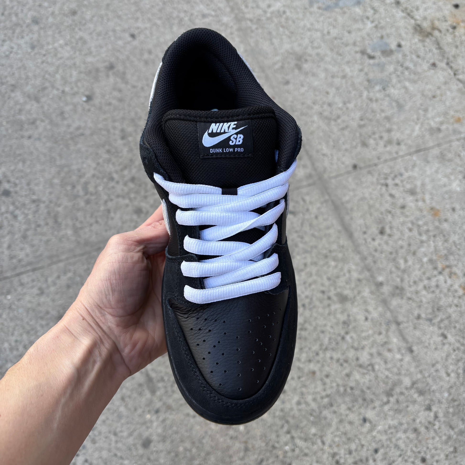 top down view of black/white nike sb dunk low