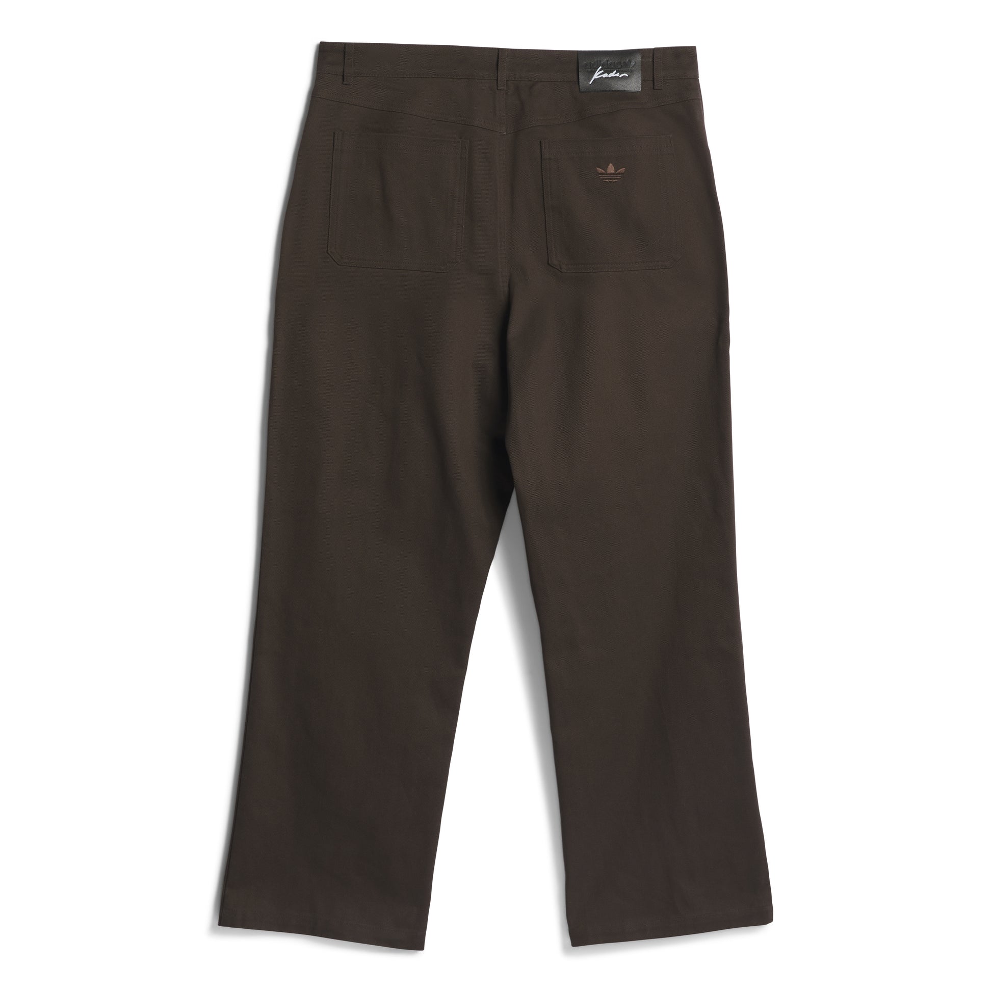Brown pants with a brand label on a white background