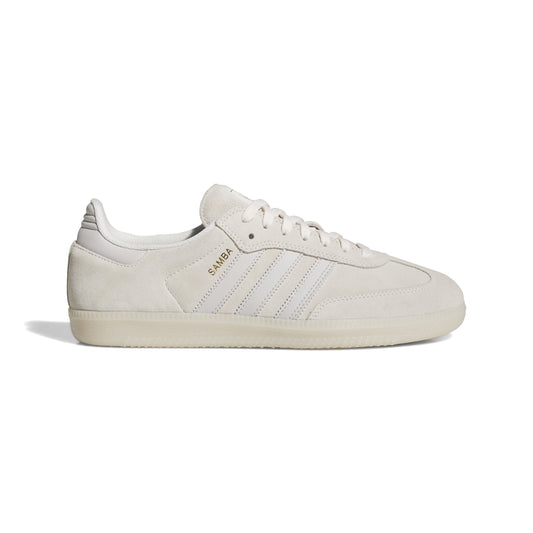 side view of white suede lowtop skateboard sneaker with clear gum rubber sole