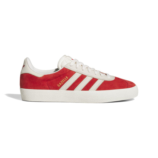 side view of red and white suede lowtop sneaker with white sole and gum outsole