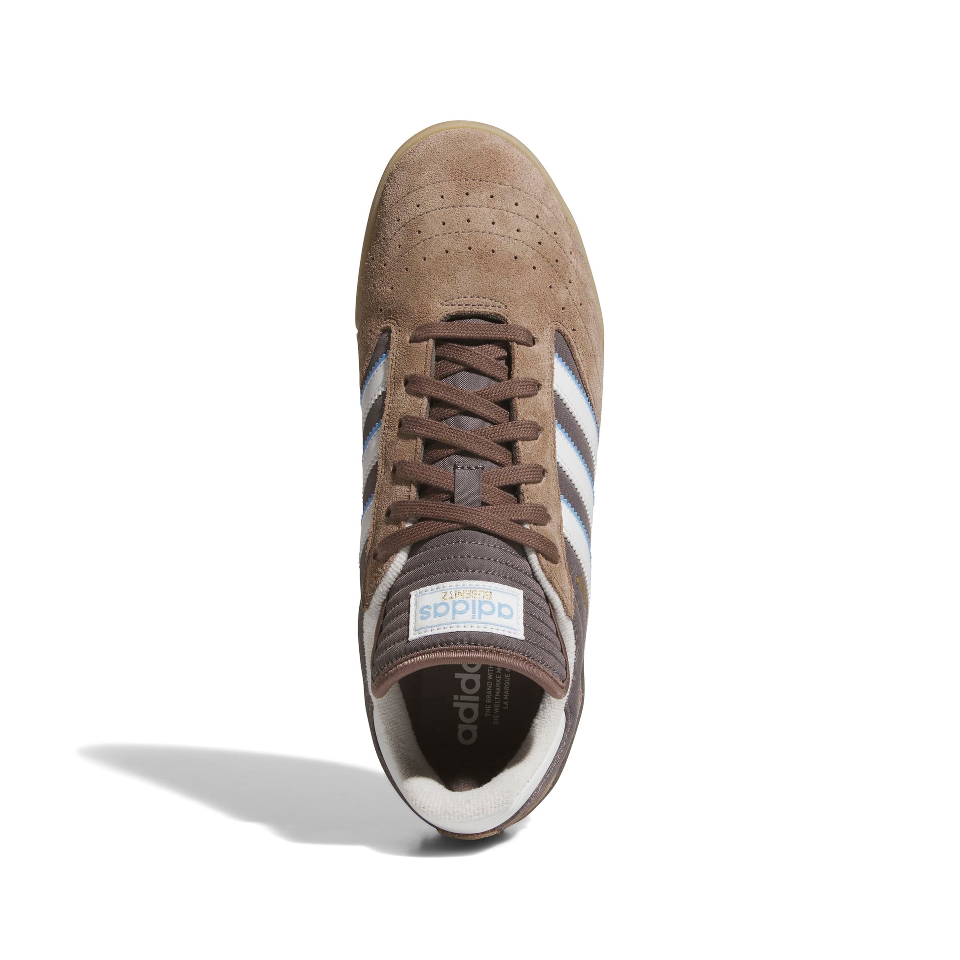 Brown Adidas sneaker with white stripes on a white background