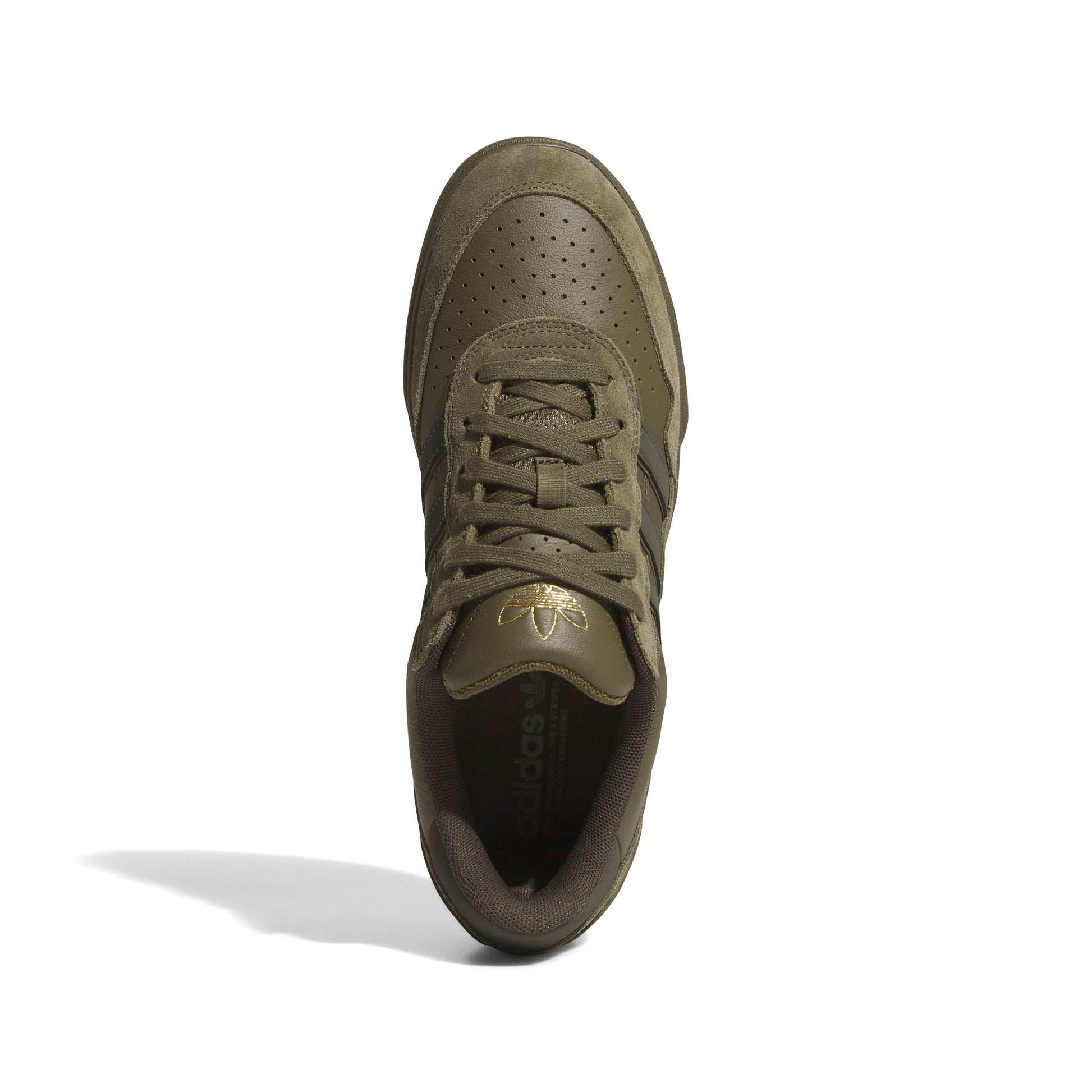 Green sneaker with brand logo on a white background