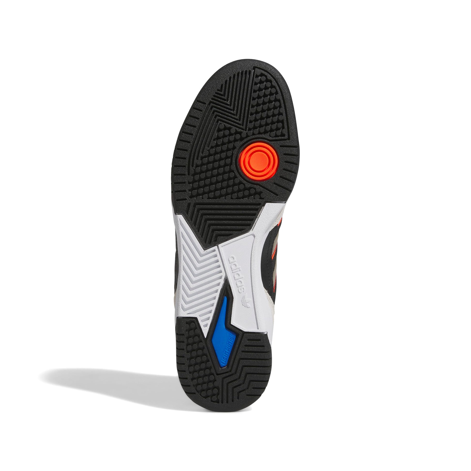 Sole of a sneaker with a red circular design on a white background