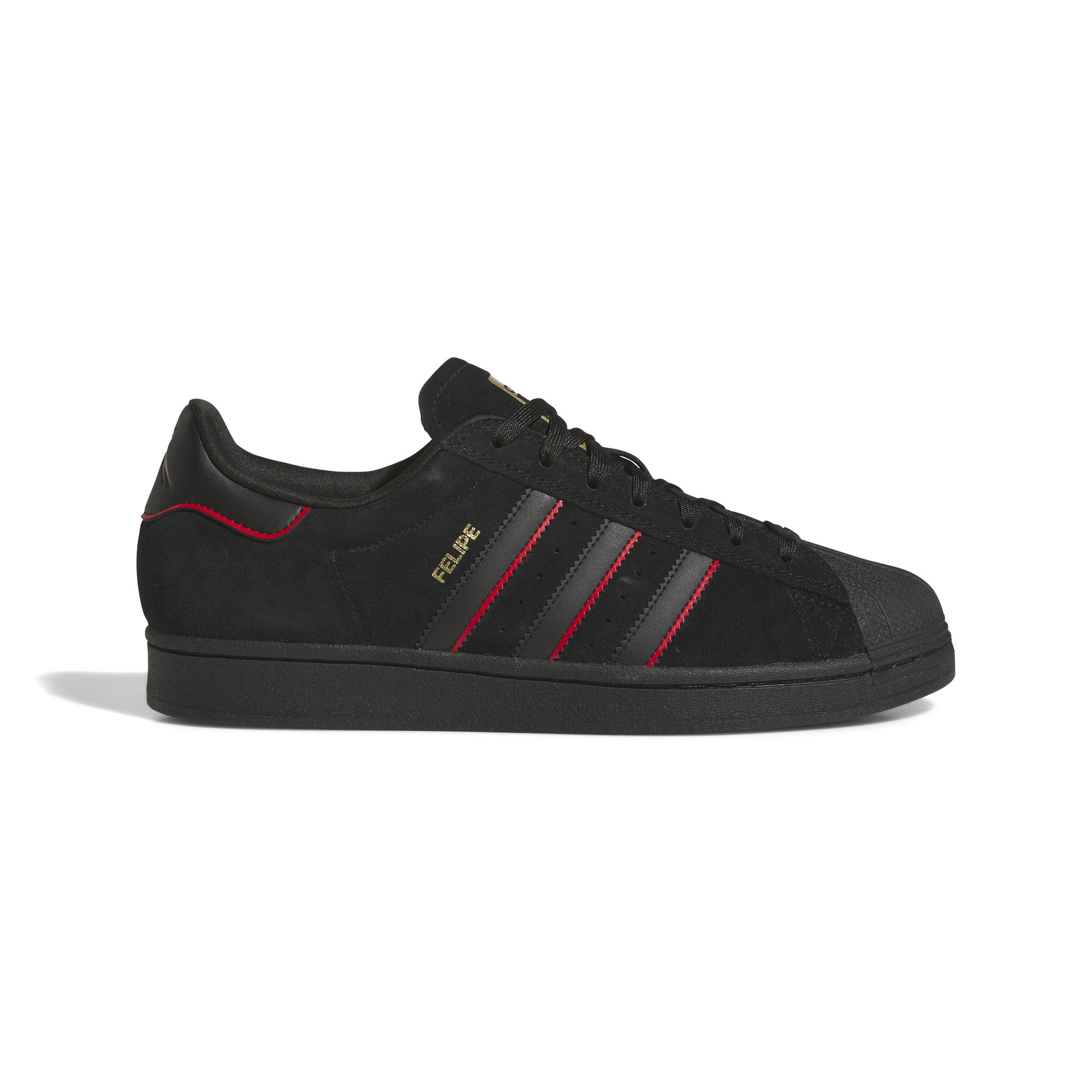 side view of black nubuck superstar sneaker with red accented stripes 