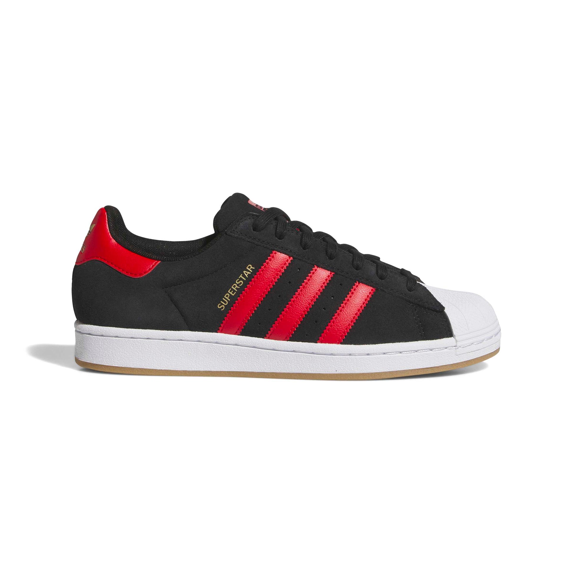 Black and red Adidas Superstar sneaker on a white background