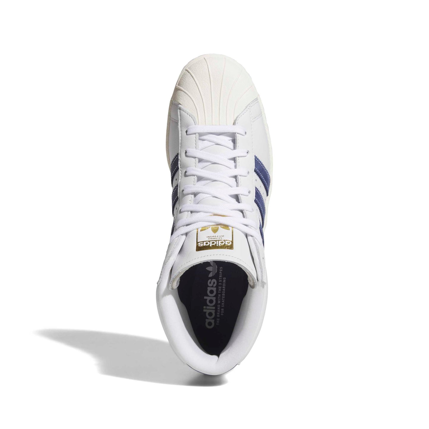 A single Adidas Superstar sneaker shown from a top-down view on a white background. The shoe is primarily white with navy blue stripes on the side, a gold logo patch on the tongue, and a black interior.