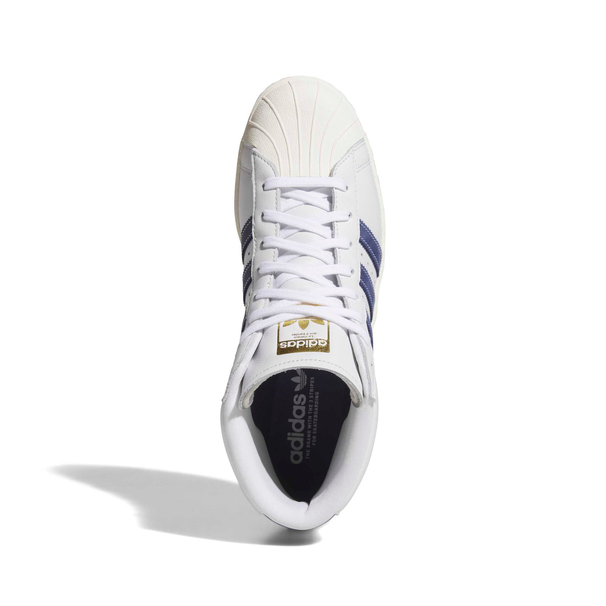 A single Adidas Superstar sneaker shown from a top-down view on a white background. The shoe is primarily white with navy blue stripes on the side, a gold logo patch on the tongue, and a black interior.