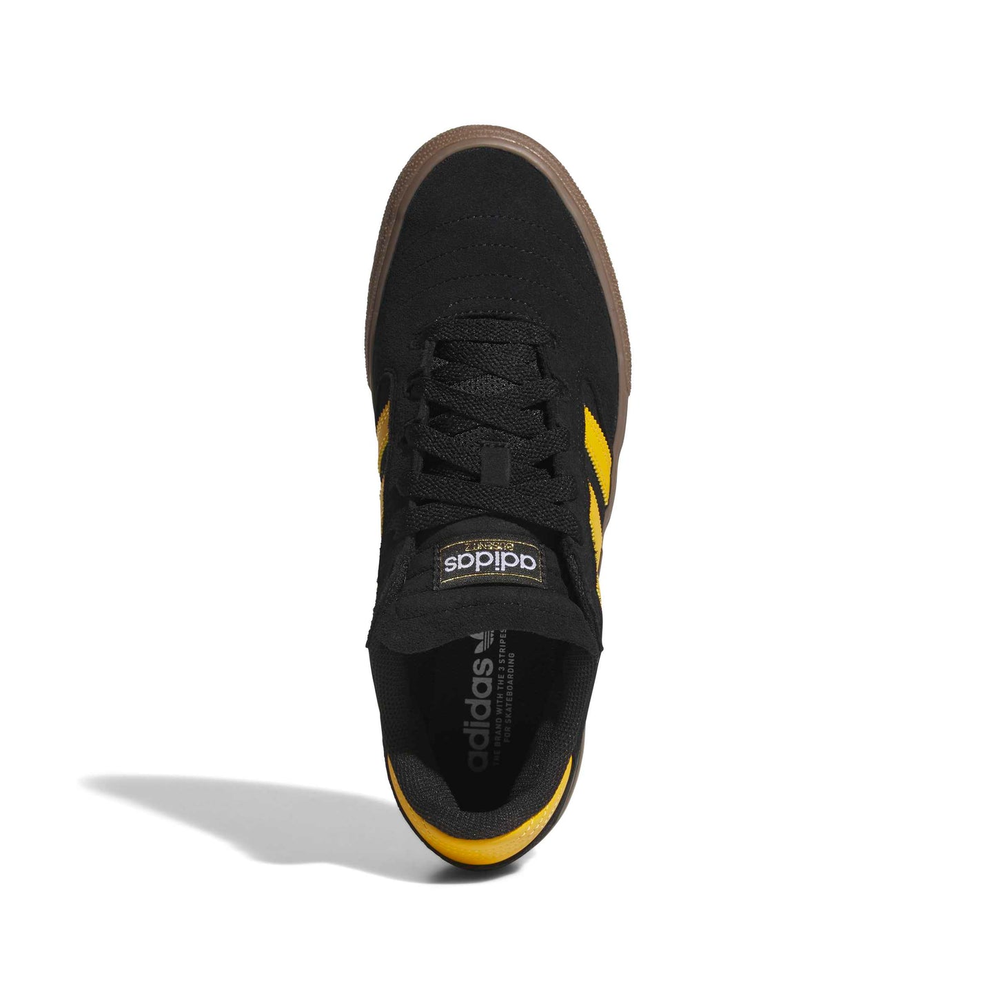 A single Adidas sneaker shown from a top-down view on a white background. The shoe features a black upper, black laces, a thick brown platform sole, and yellow stripes on the sides.