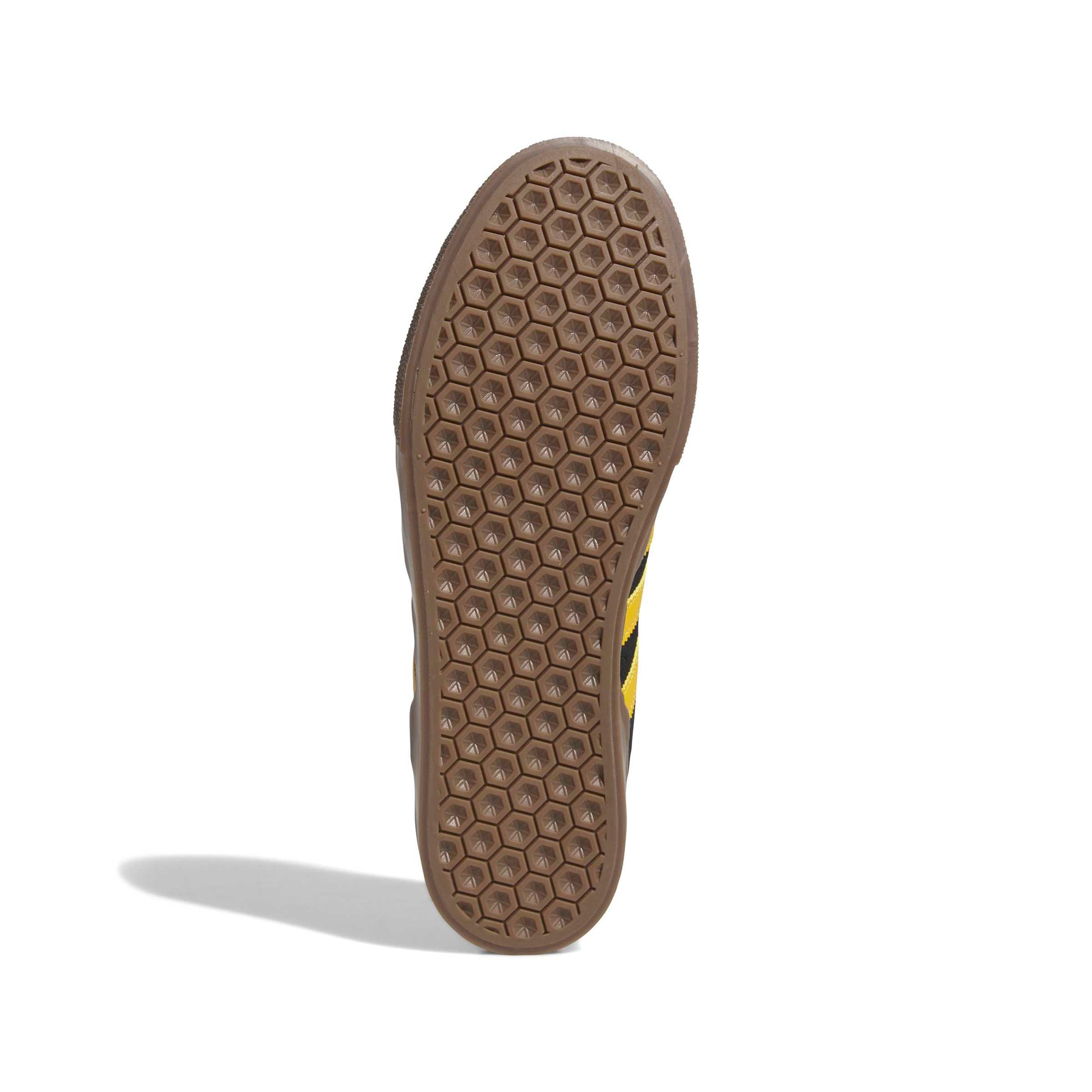 Close-up of a brown shoe sole with a textured pattern on a white background