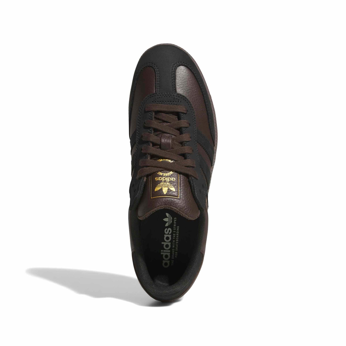 A single Adidas Samba sneakers in dark brown and black, viewed from overhead back on a white background with a soft shadow.