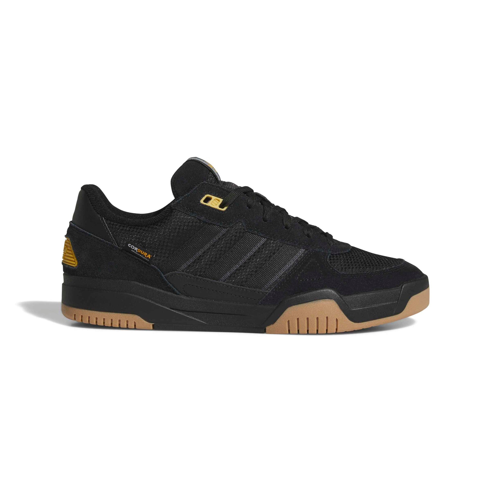 Black suede adidas sneaker on a white background