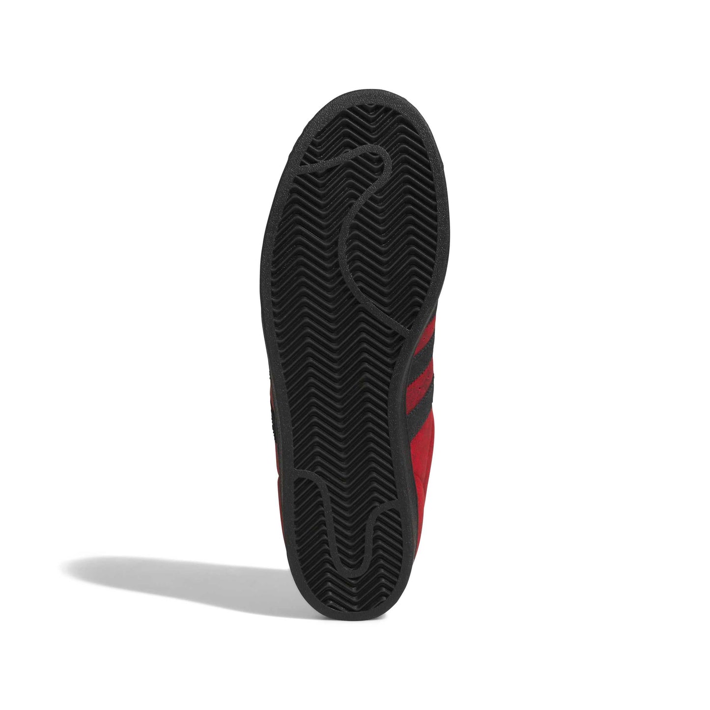 The black rubber outsole of a red and black shoe, shown vertically against a white background with a soft shadow.