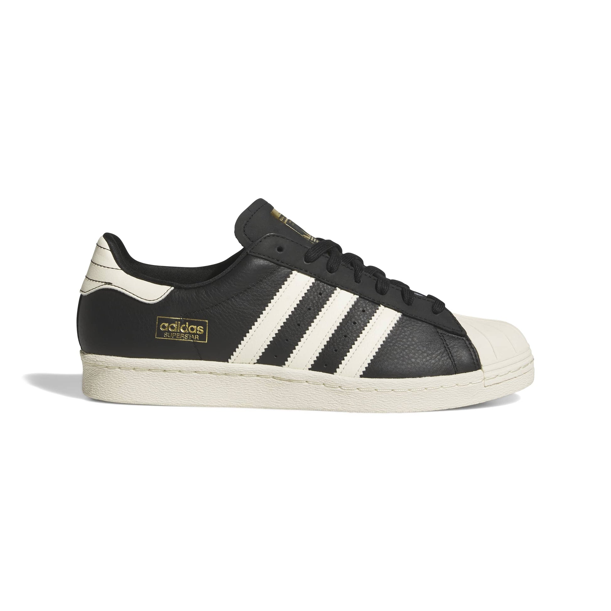 Black and white Adidas sneaker with three stripes on a white background