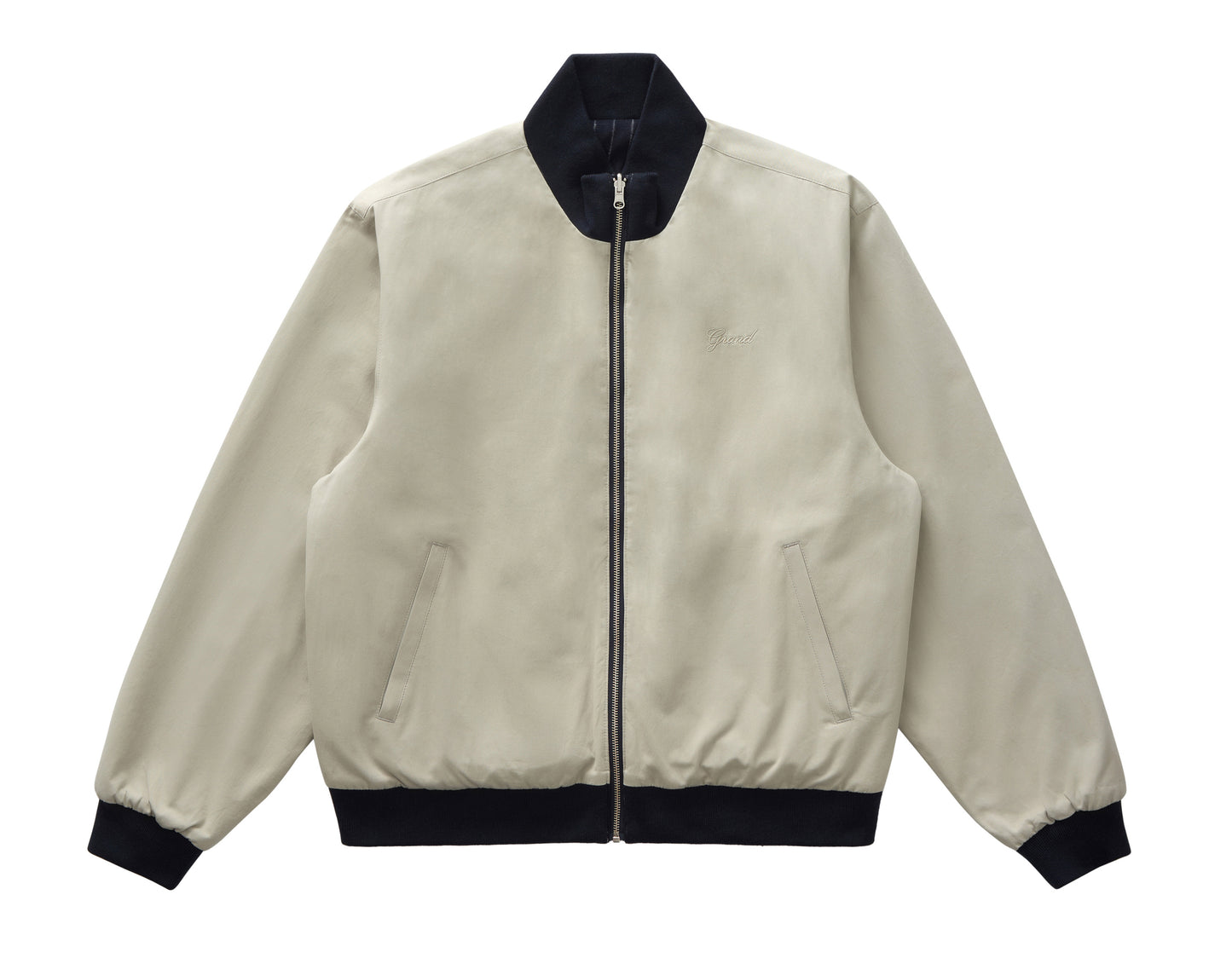 Beige bomber jacket with black trim on a white background