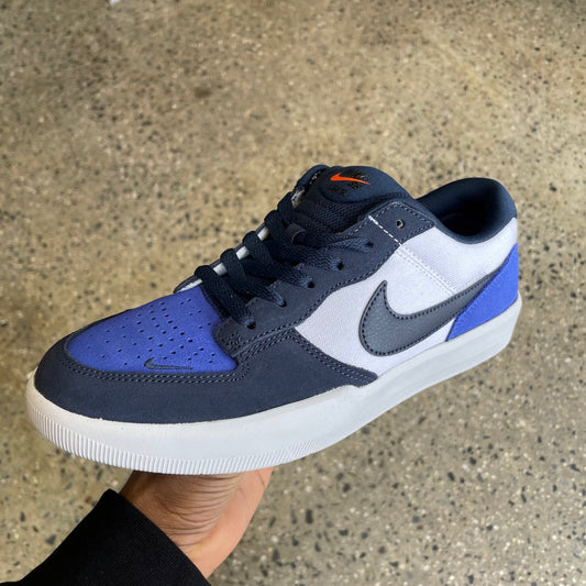 blue, black, and white sneaker with white sole