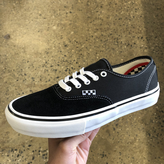 side view of black suede and canvas low top skateboard shoe