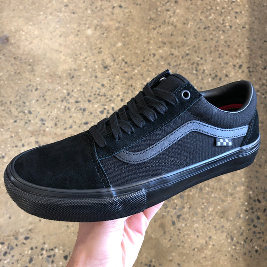Side view of all blackout suede and canvas skateboard shoe, black sole as well