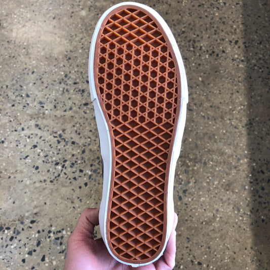 Bottom of low top skate shoe view of gum rubber vans waffle cup sole