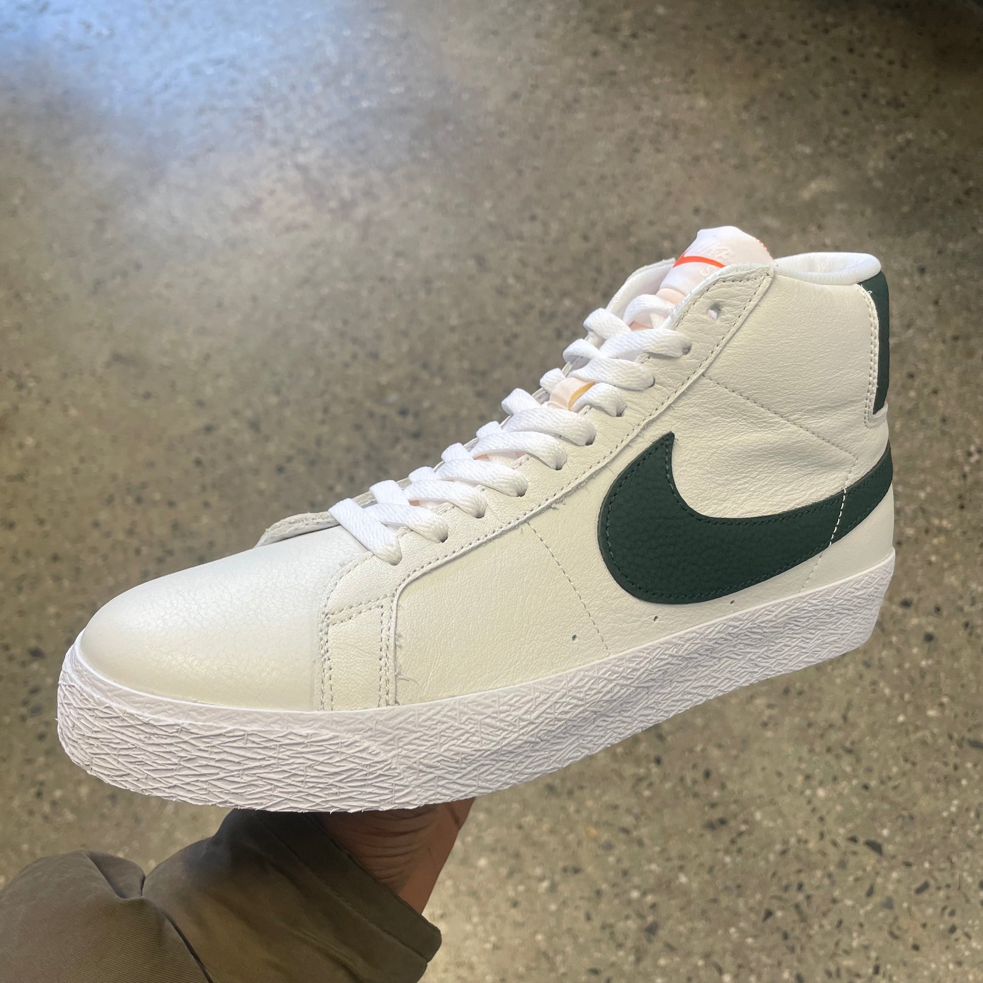white and green hi top with white sole