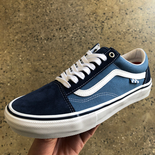 side view of navy suede and canvas low top skate shoe, white outsole