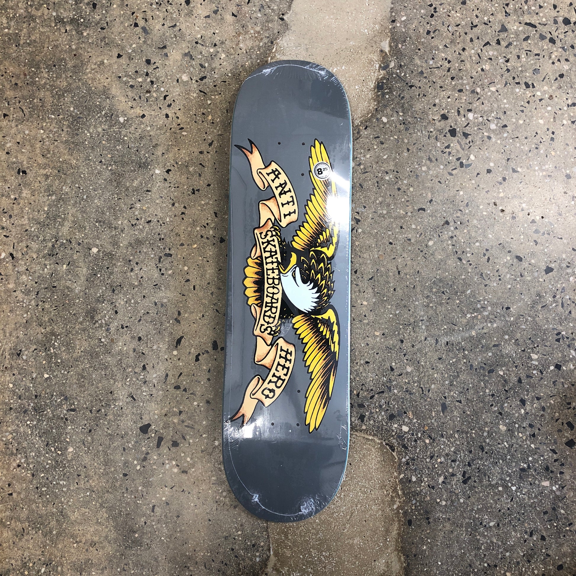 grey skateboard with antihero eagle across the bottom