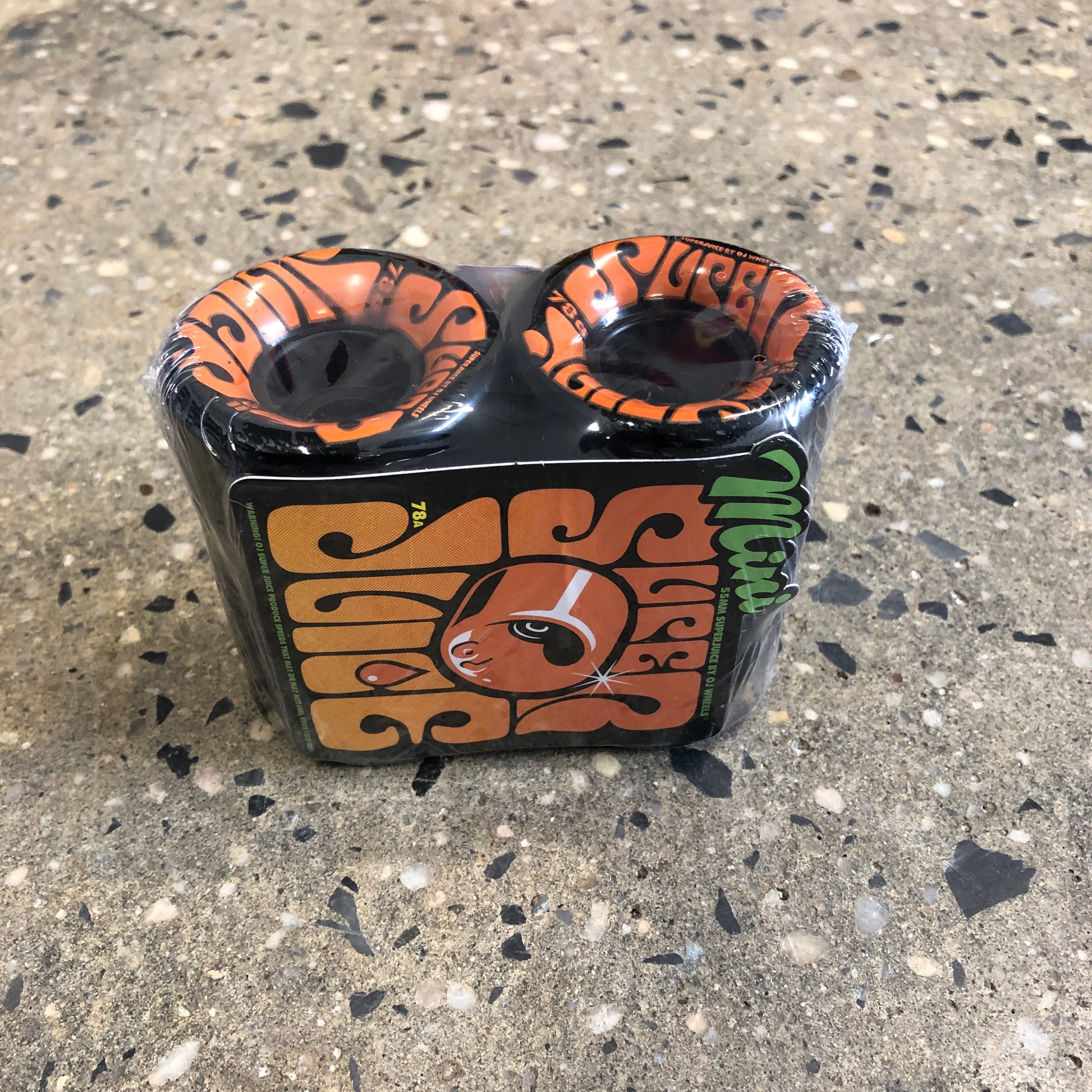 black skateboard wheel with orange type