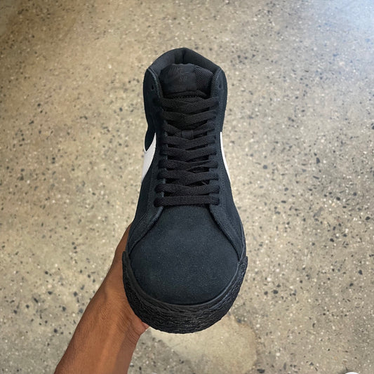 top down view of black suede sneaker with black laces and black outsole