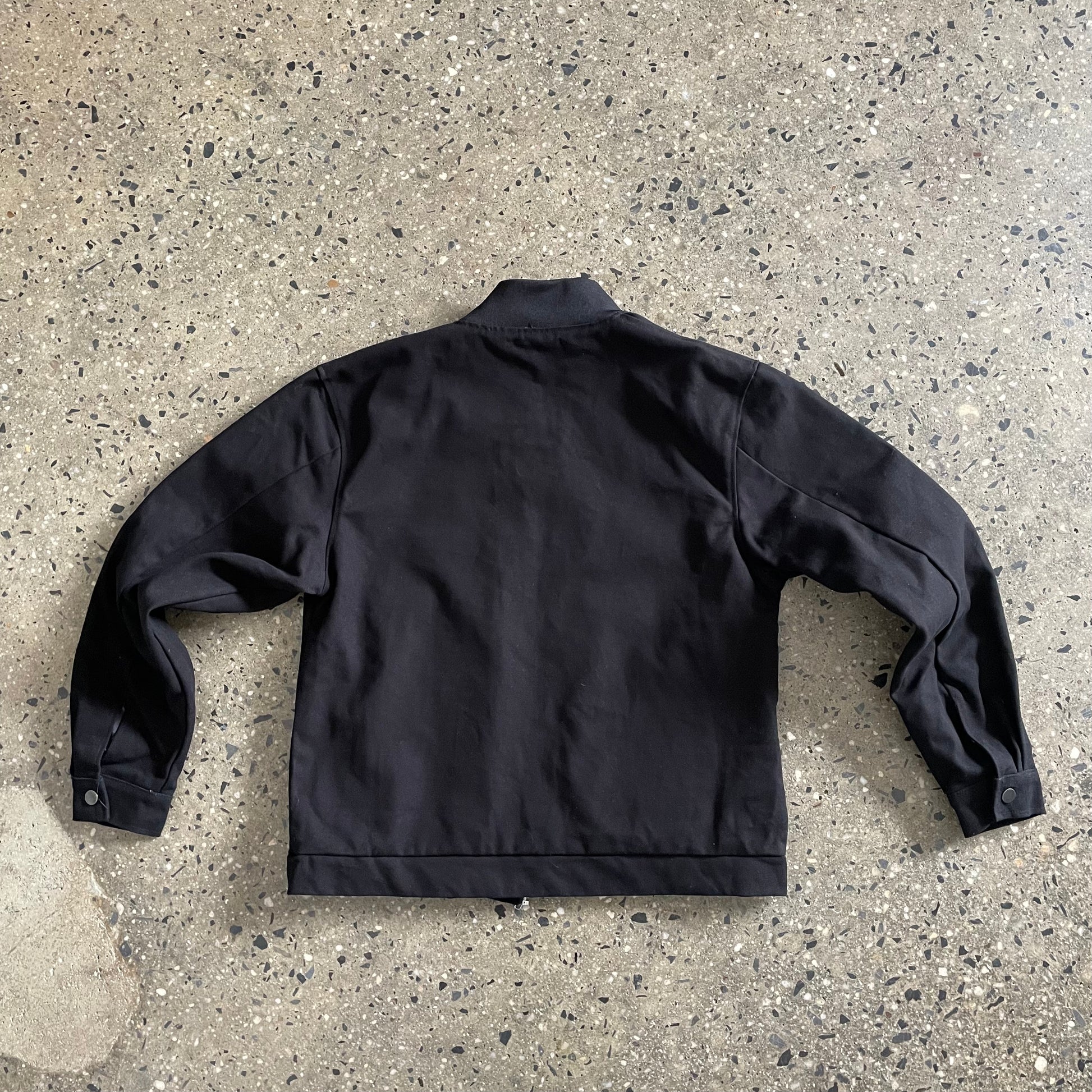 back view of black duck canvas jacket