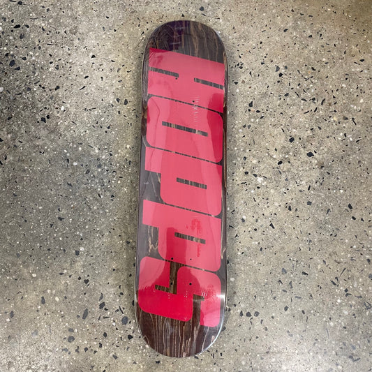 wood stained deck with big red text across the bottom