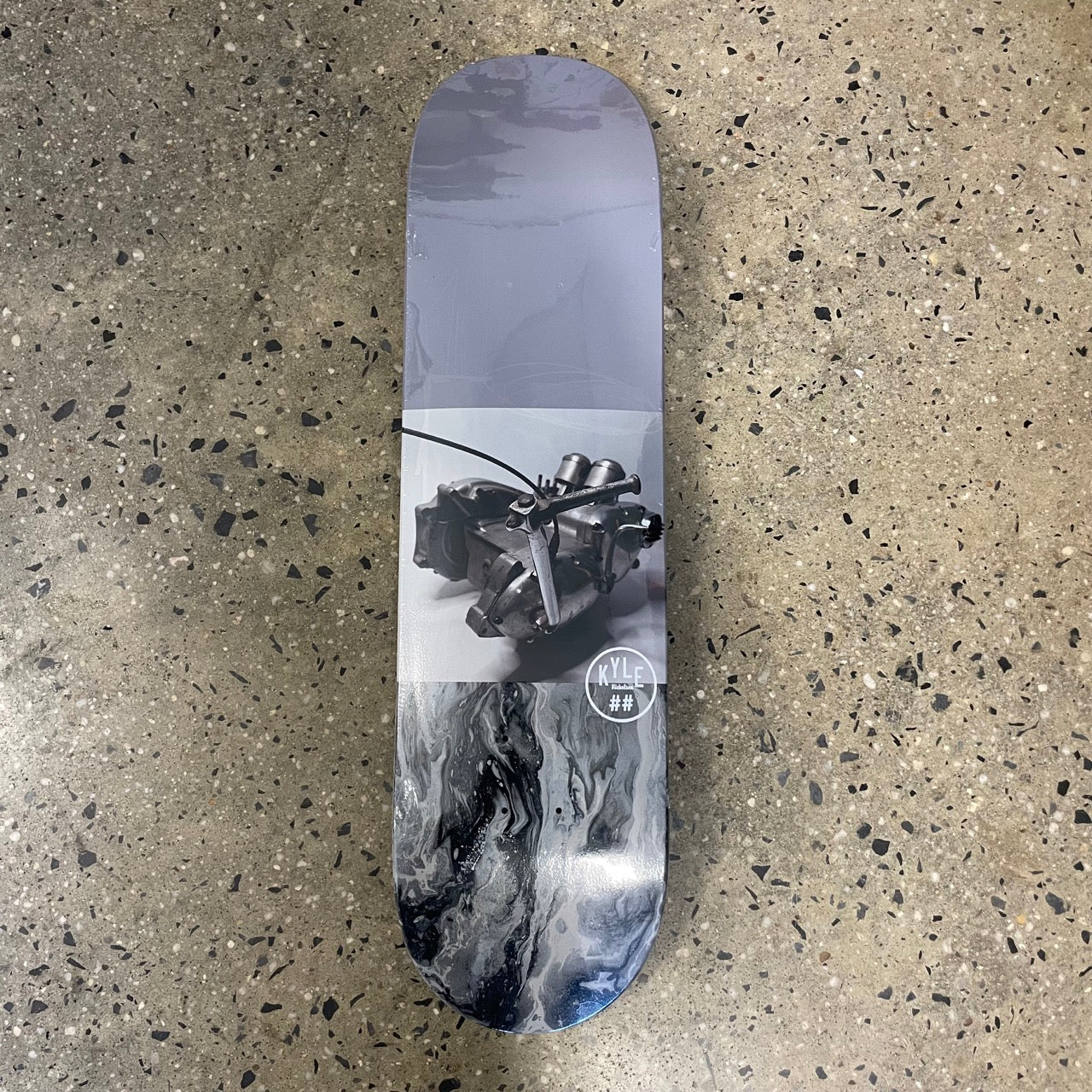 grey, black, and white skate deck